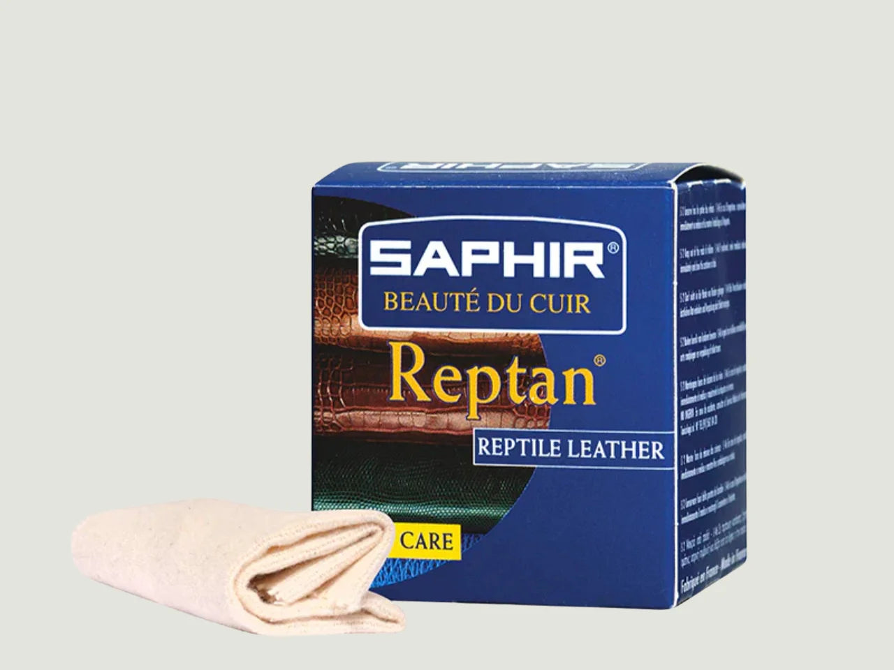 Frasco de Saphir Reptan, crema incolora para pieles exóticas como cocodrilo y serpiente. Enriquecida con lanolina y ceras minerales. Protección y brillo premium.